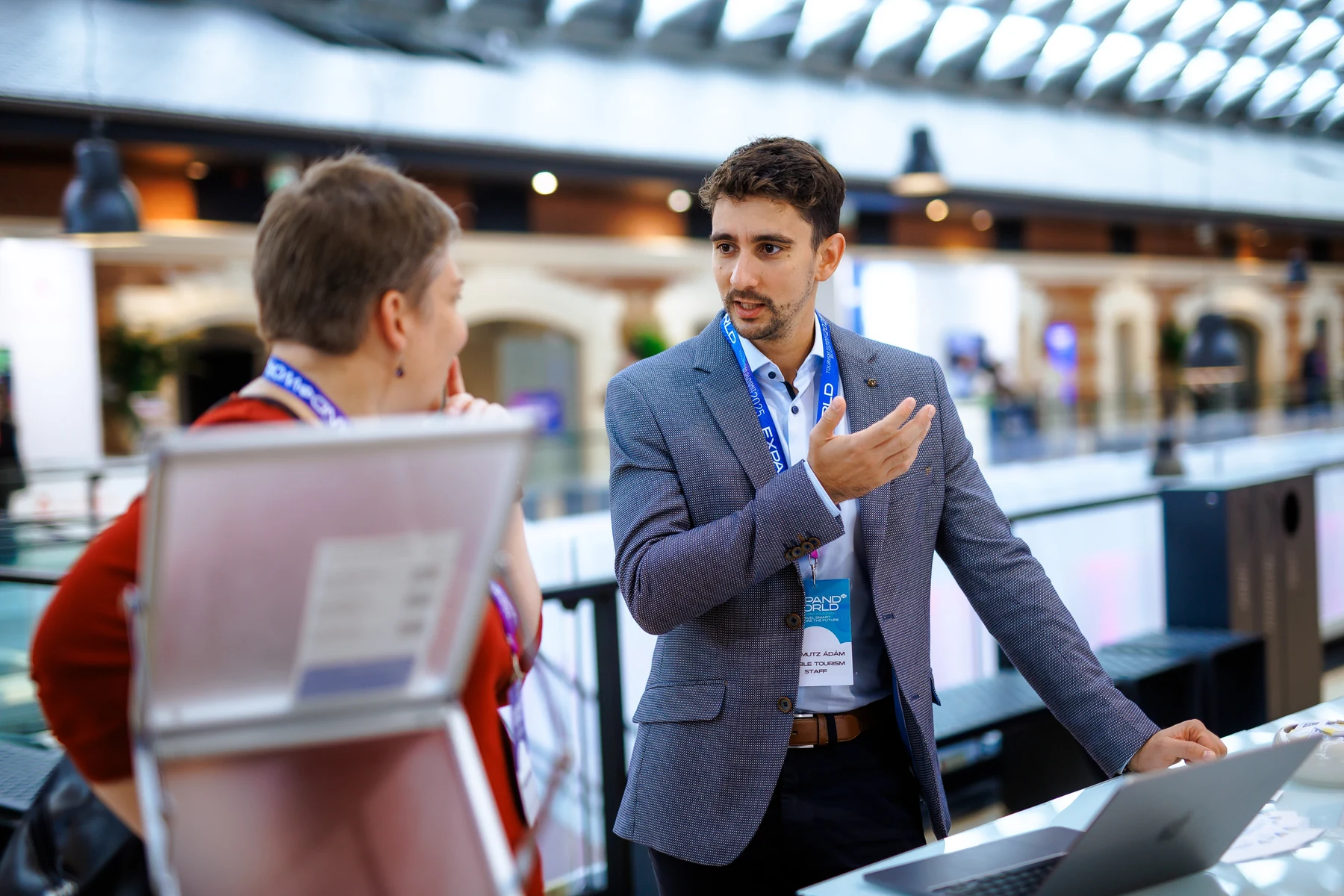 Adam Schmutz in conversation at the Visible Tourism stand during Tourism Summit 2025.